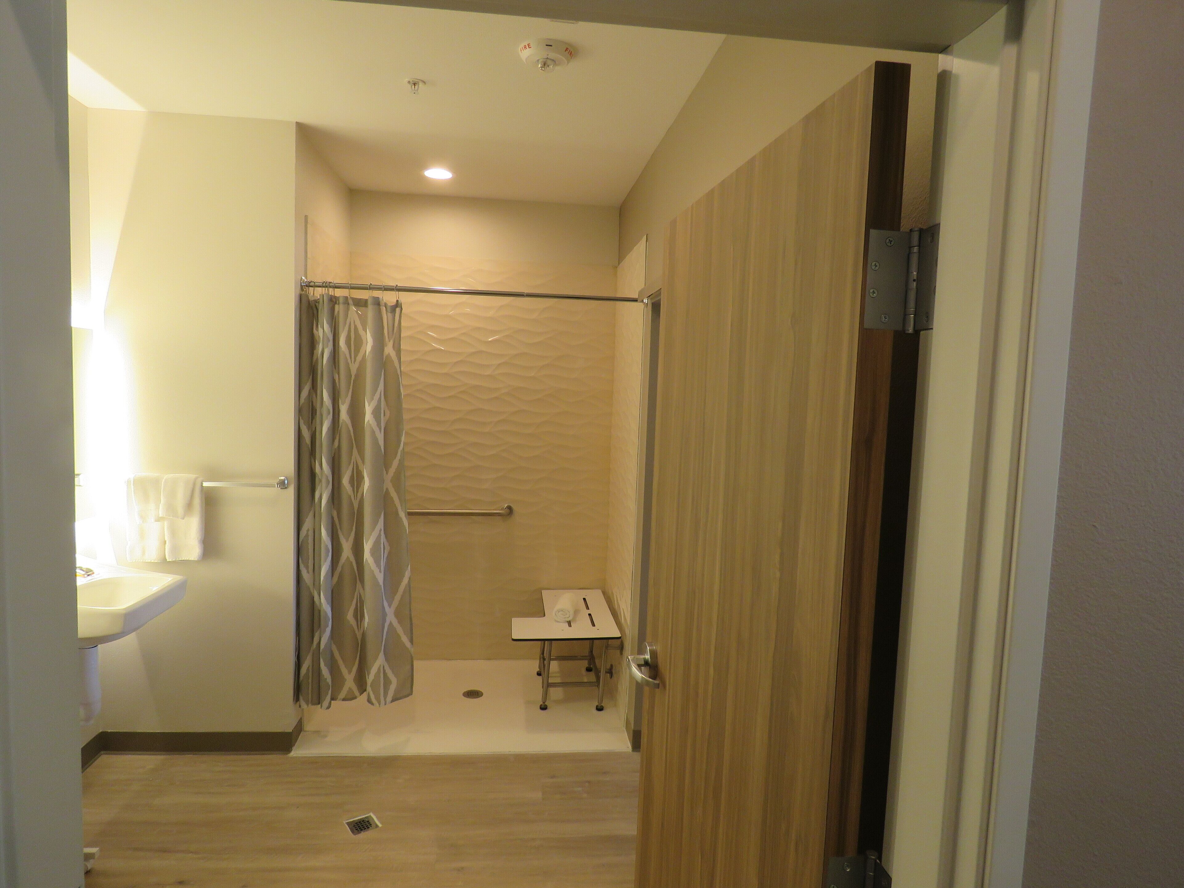 suite, 1 king bed, accessible, non smoking (mobility) | bathroom | shower, hydromassage showerhead, designer toiletries, hair dryer