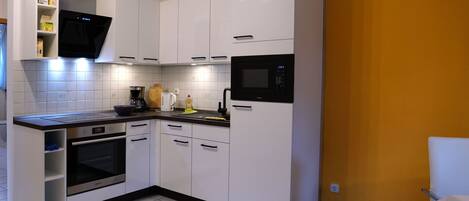 Fridge, oven, cookware/dishes/utensils