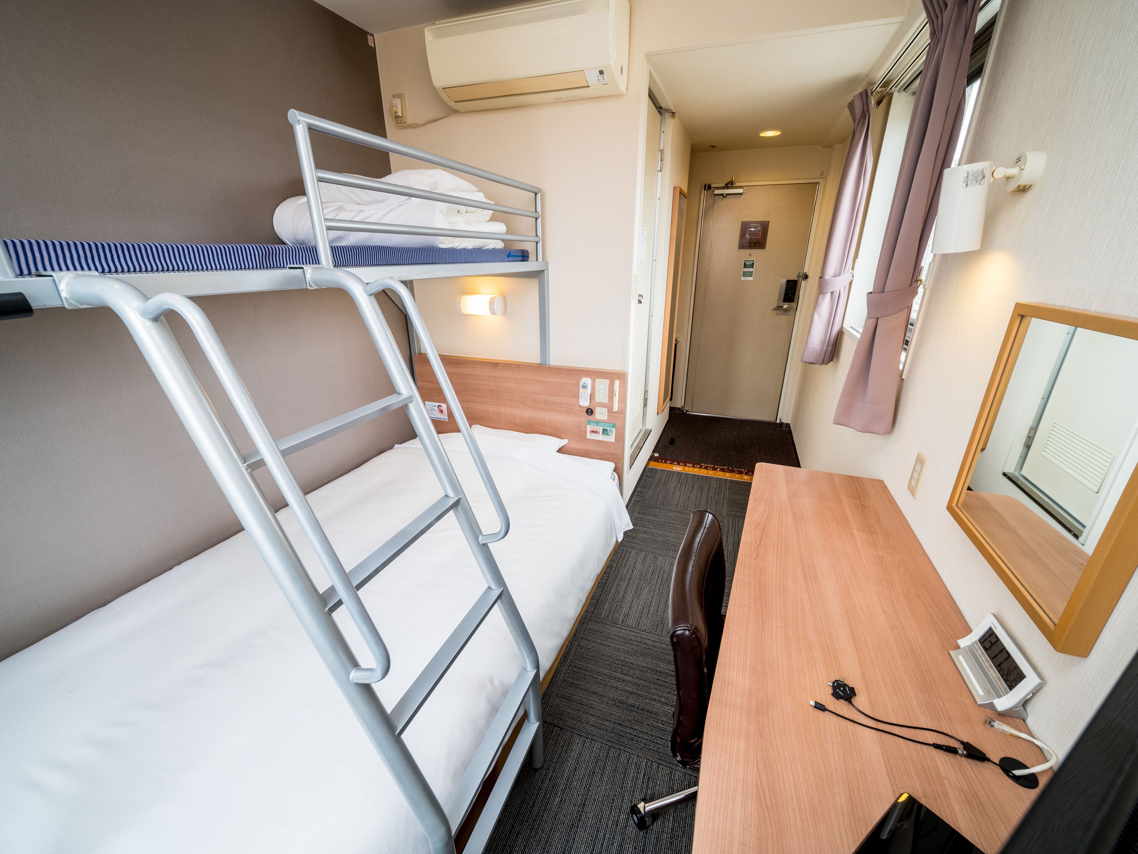 room with 1 double bed and 1 bunk bed | blackout curtains, iron/ironing board, free wifi, bed sheets