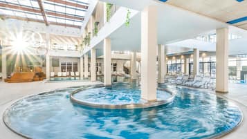 Indoor pool, seasonal outdoor pool, pool loungers, lifeguards on site