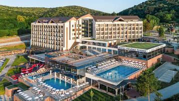 Indoor pool, seasonal outdoor pool, sun loungers, lifeguards on site