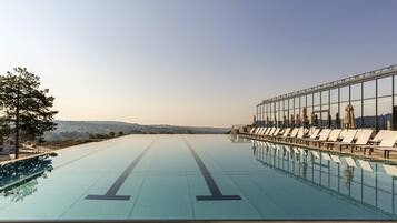 Indoor pool, seasonal outdoor pool, sun loungers, lifeguards on site