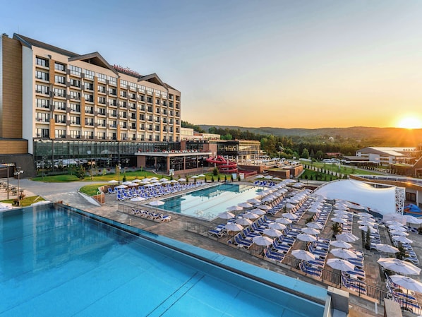 Indoor pool, seasonal outdoor pool, pool loungers, lifeguards on site