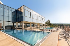Indoor pool, seasonal outdoor pool, pool loungers, lifeguards on site