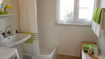 Shower, hair dryer, towels, toilet paper