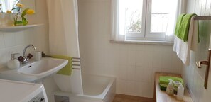 Shower, hair dryer, towels, toilet paper