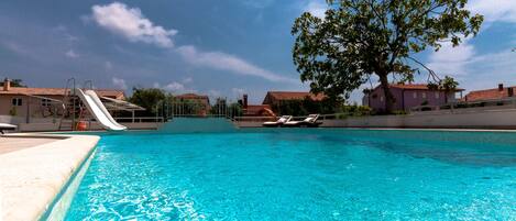 Outdoor pool, pool umbrellas, pool loungers