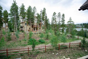 Set amidst a forested area, this lodge offers a secluded retreat with a rustic facade and natural surroundings.