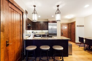 Enjoy cooking in this well-equipped kitchen with a central island and bar stools.