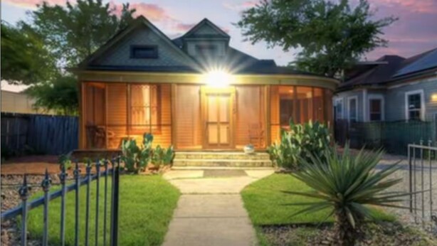 A two-story house with a front porch, a visible garage, and a well-maintained lawn. - TOBIN HILL OASIS - PRIVATE POOL HOUSE 3BD/2.5BA, SCREENED IN PORCH, FULL KITCHEN (San Antonio)