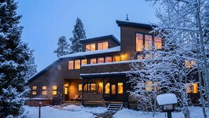 A modern log cabin with a covered porch, a hot tub, and a snow-covered landscape. - Mountain Chalet Just Blocks from Gondola & Main St (Breckenridge)