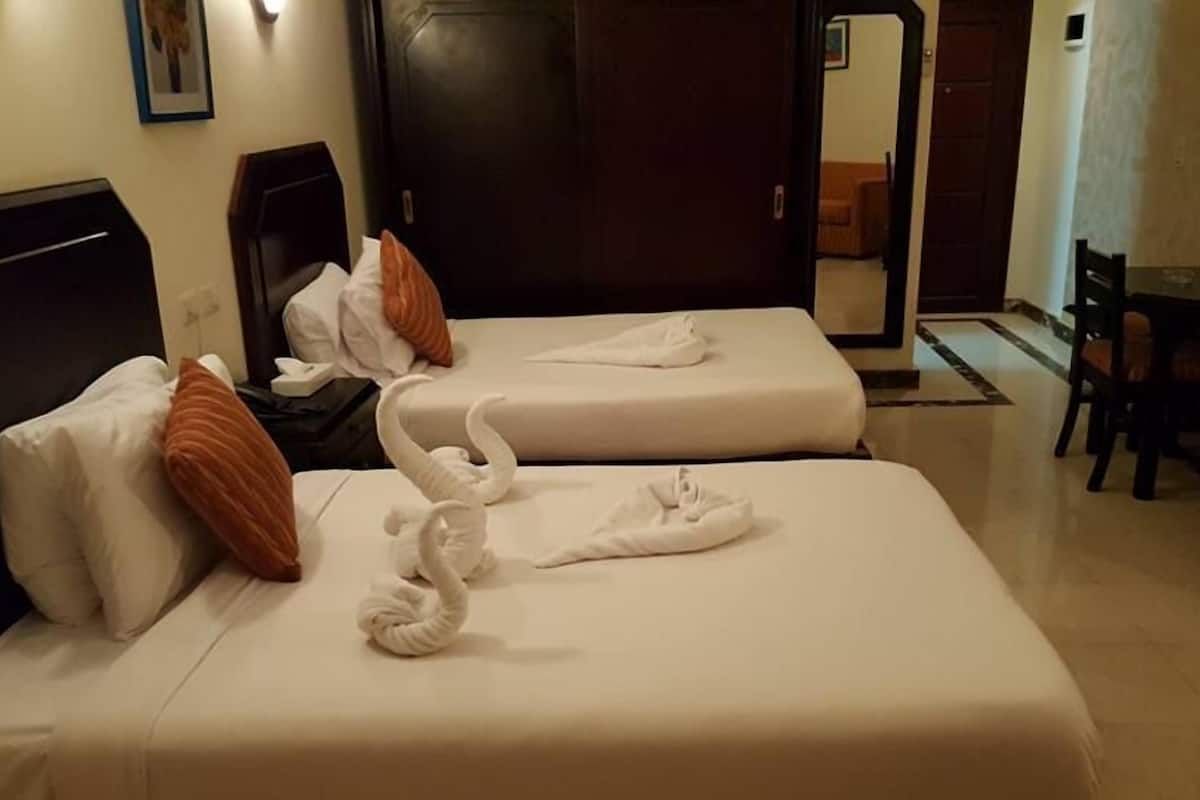 1 habitación, caja de seguridad en la habitación y ropa de cama