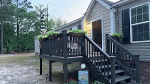 A wooden deck with a sign that reads "Our Deck". - Great property for contract healthcare workers! (Hamlet)