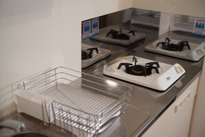 Apartment | Private kitchen | Fridge, microwave, stovetop, rice cooker - Kyobashi Base (Osaka)