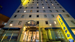 A multi-story hotel with a prominent entrance and a glass facade. - Super Hotel Ube Kosan Street (Ube)