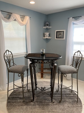 Enjoy meals in this cozy dining area with a round table and four comfortable chairs.