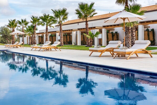 Seasonal outdoor pool, pool umbrellas, pool loungers