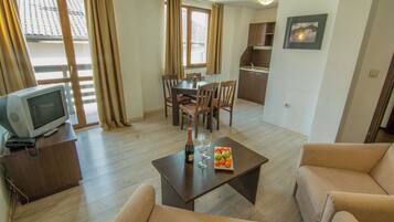 Apartment, 1 Bedroom, Balcony | Living area | TV