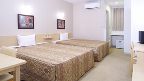 A hotel room with two beds, a desk, a chair, and a television. - Family Lodge Hatagoya Meihan Nagashima (Kuwana)
