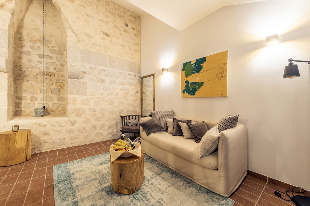 Suite Deluxe | Soggiorno | TV a schermo piatto