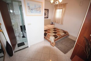 Apartamento, 1 quarto, terraço, vista para o jardim | 2 quartos, roupa de cama