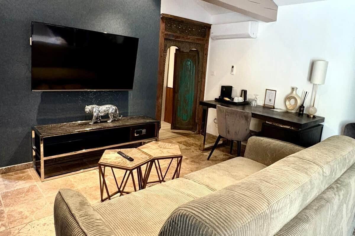 Deluxe Suite, Terrace, Poolside | In-room safe, individually decorated, individually furnished, desk