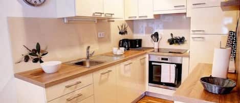 Apartment (Three Bedroom Apartment) | Private kitchen | Fridge, dining tables