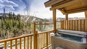 A hot tub on a wooden deck with a mountain view. - Abode at Black Bear #403, hot tub, pool & gym, steps to trails (Park City)