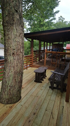 A wooden deck with a pergola, picnic tables, and benches. - AN OWL and the MOON.  Get-Away in Mohican State Park. Location perfect! (Loudonville)