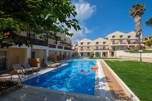 Seasonal outdoor pool, open 10:00 AM to 6:00 PM, pool umbrellas