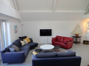 Cabaña Deluxe | Sala de estar | Suelo radiante