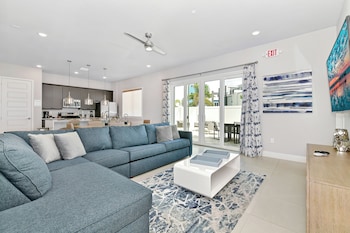 Luxury Condo, 3 Bedrooms, Patio | Living area | 42-inch TV with satellite channels at Spectrum Resort Villas Orlando and Waterparks