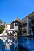 Outdoor pool, open 9:00 AM to 9:00 PM, pool umbrellas, sun loungers