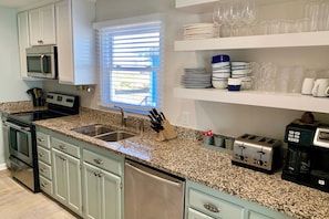 Coffee/tea maker, fridge, microwave, oven