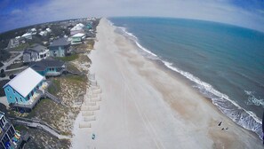 On the beach, sun-loungers
