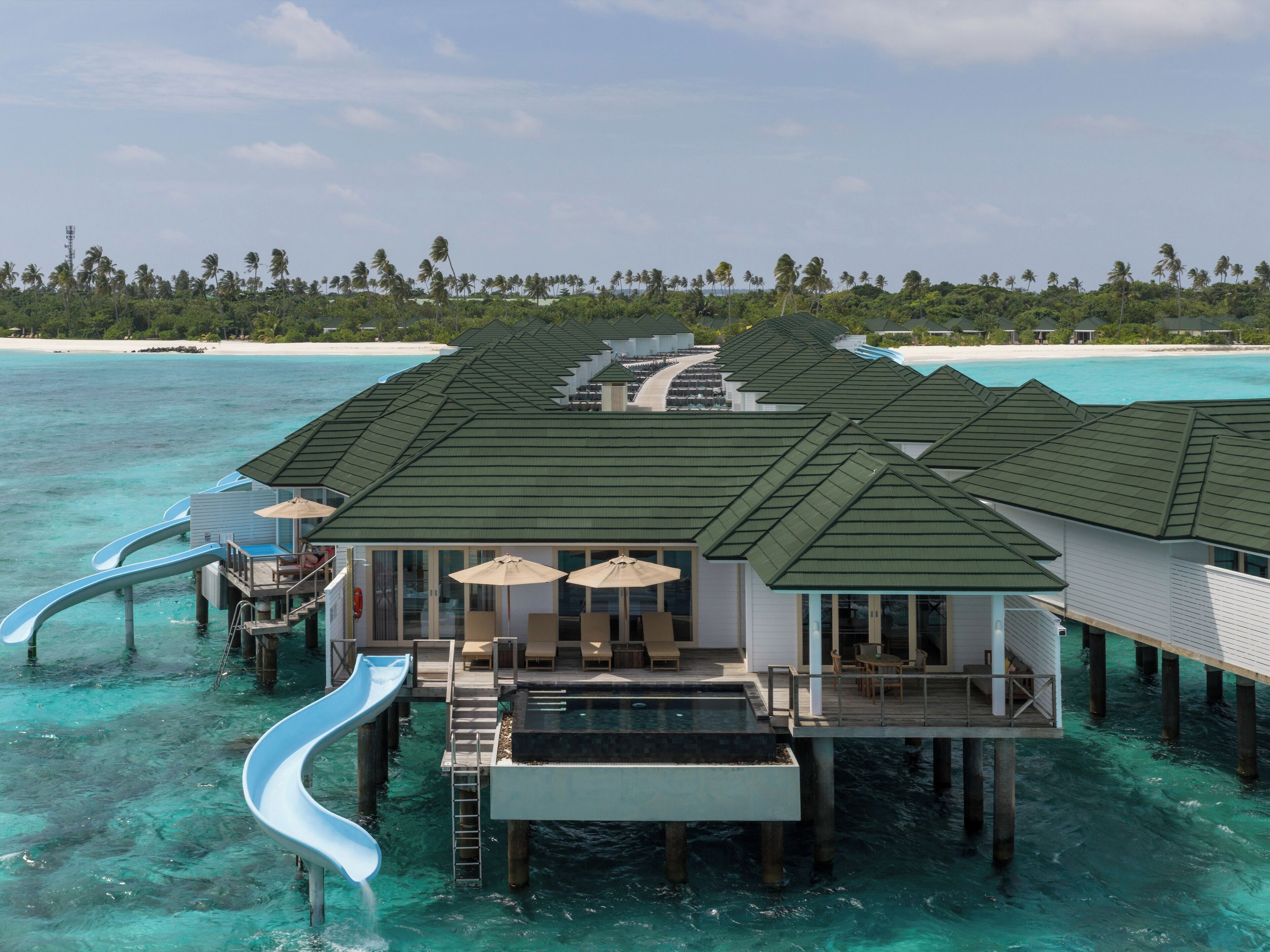 Water Pavilion with Pool + Slide - Free shared seaplane for 2 guests, minimum 7-night stay | Egyptian cotton sheets, premium bedding, down comforters