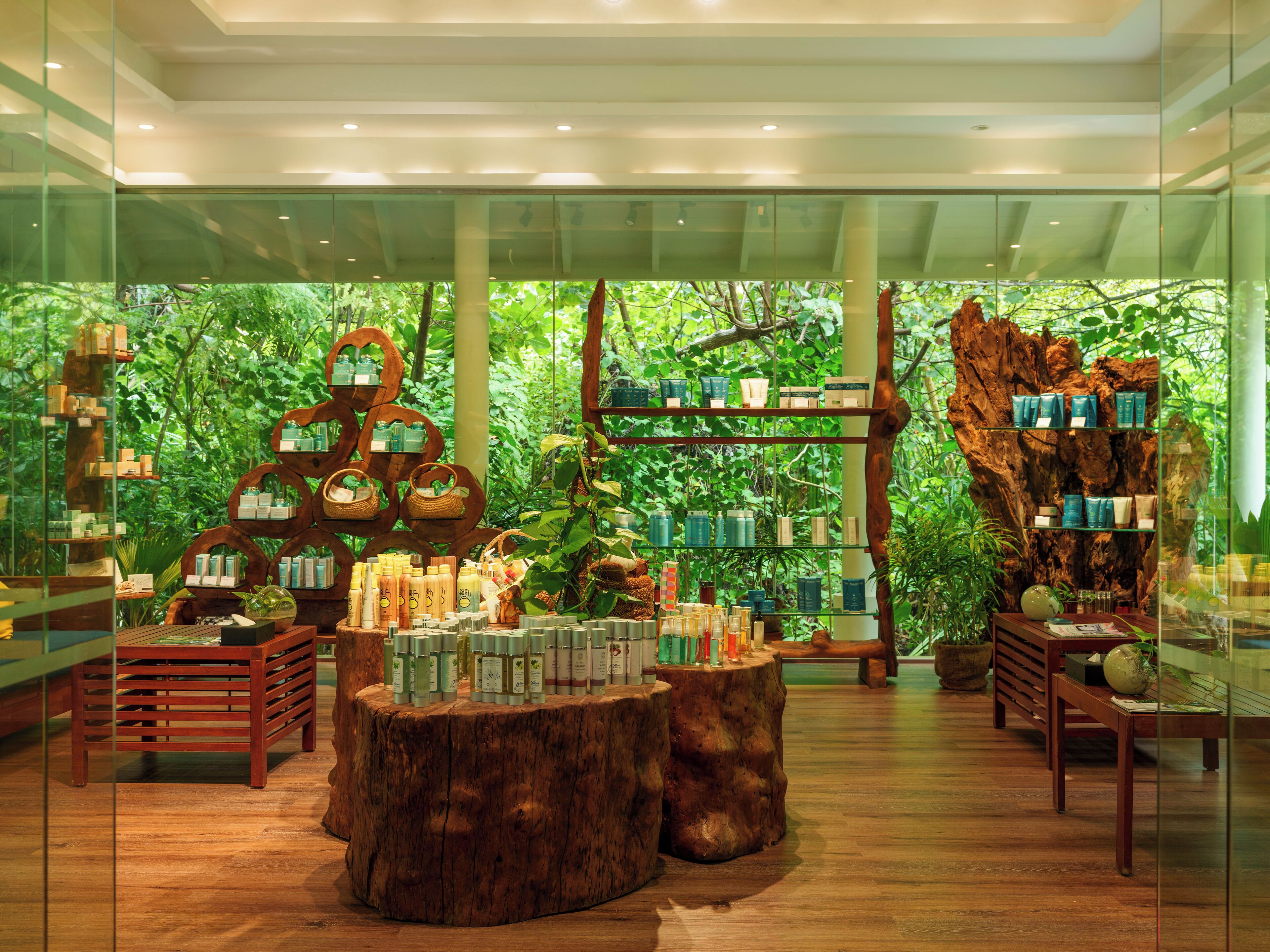 A store with wooden shelves and tables displaying various products.
