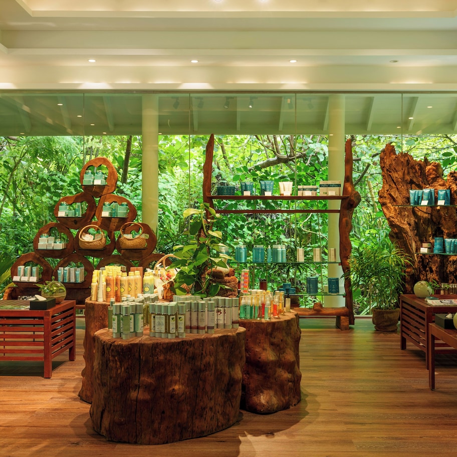 A store with wooden shelves and tables displaying various products.