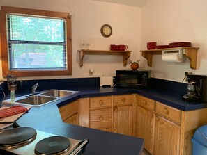 Fridge, microwave, stovetop, coffee/tea maker