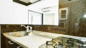 Fridge, microwave, stovetop, cookware/dishes/utensils