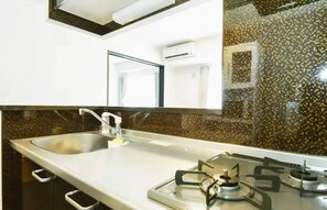 Fridge, microwave, stovetop, cookware/dishes/utensils