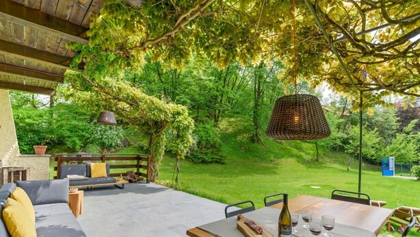 An outdoor patio with a table, chairs, and a sofa. - Bright and welcoming two-level villa with large garden, just 5km from Bellagio and 2.5km from the pretty village of Civenna! The villa is located halfway between the picturesque Bellagio (a stunning town on the Como Lake) and Mount S.Primo, which offers  (Gallasco-cernobbio)