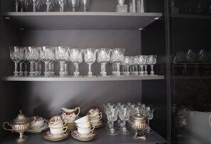 A display of glassware and china on shelves. - Maison Art Gallery, just a few steps from the Duomo! (Milano)
