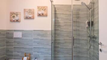 Shower, free toiletries, hair dryer, slippers