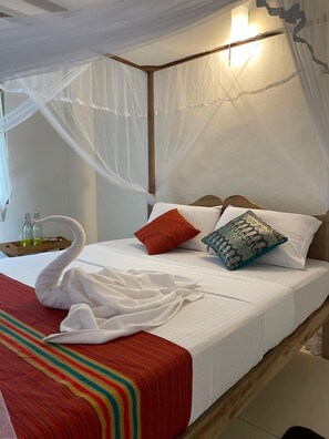 Habitació quàdruple Deluxe | Matalassos de la marca Select Comfort i caixa forta a l'habitació 