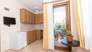 Apartment | Private kitchen | Fridge, highchair