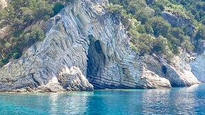 A coastal cliff with a clear blue sea in front. - GREECE, EXCLUSIVE HOLIDAY on Sailing yacht from ATHENS, wIth SKIPPER and CHEF (Lefkada)