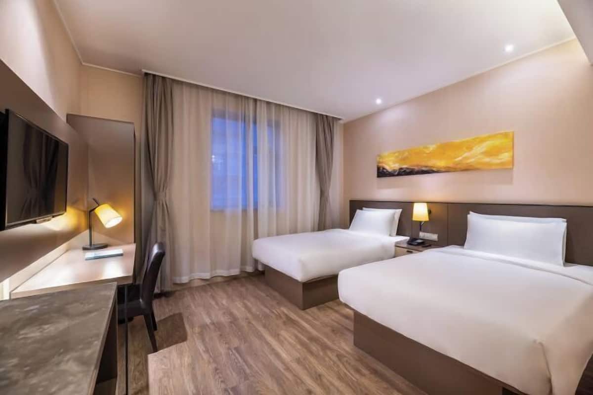 Desk, blackout curtains, free WiFi, bed sheets