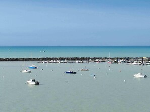 A marina with various boats docked, a rocky breakwater, and calm water. - Ibis Styles La Rochelle Thalasso Chatelaillon (Chatelaillon-Plage)
