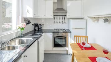 Oven, coffee/tea maker, electric kettle, dining tables